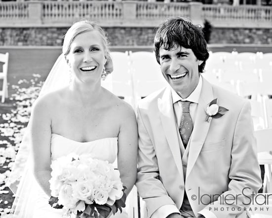 bride and groom laughing after wedding