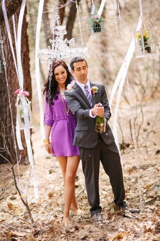 popping the cork to celebrate their engagement