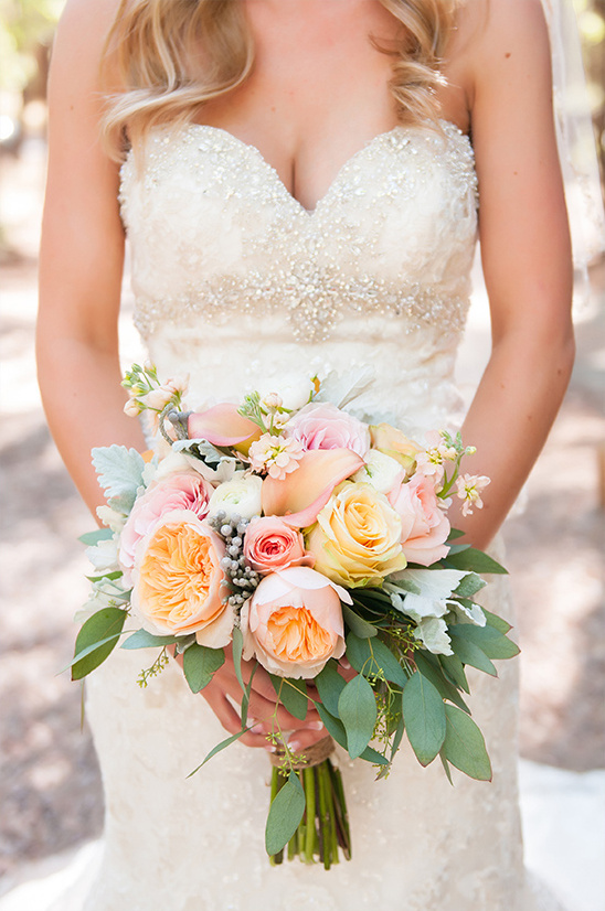 peach and pink bouquet with leafy greens