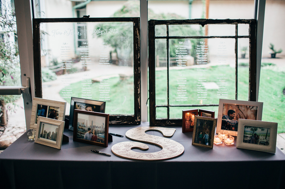 handwritten window wedding seating chart