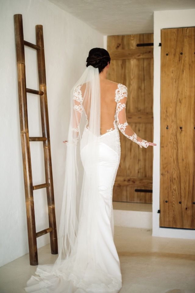 back showcasing wedding dress with long lace sleeves