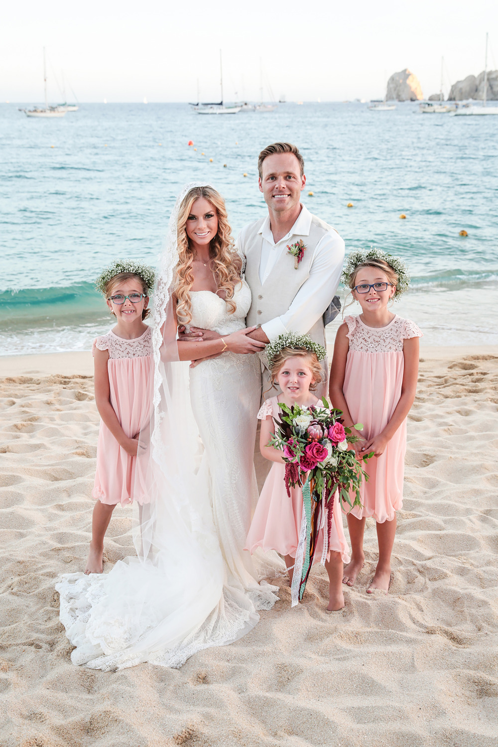 beautiful wedding attire with pink flower girl dresses