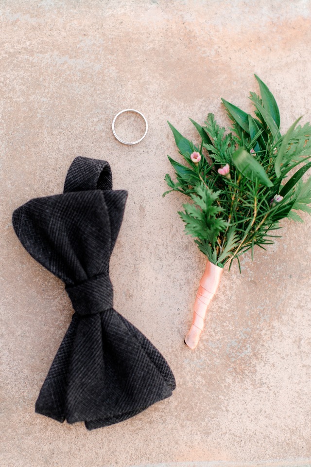 black bow tie and organic boutonniere