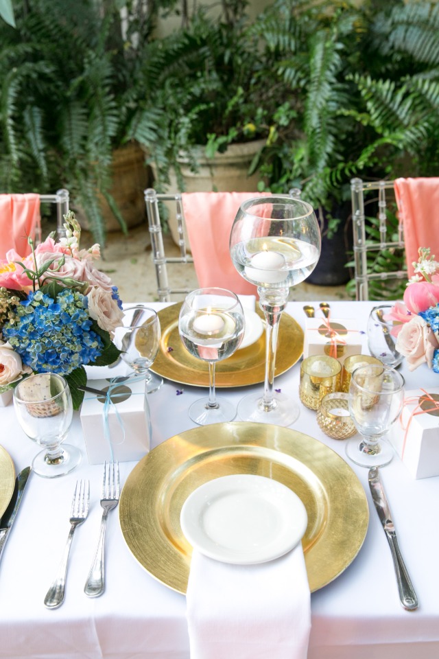 gold wedding chargers with floating candle centerpieces