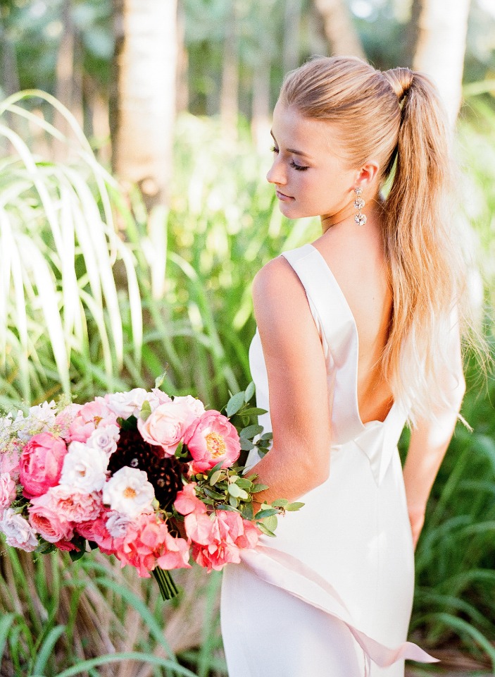 high ponytail and dramatic backed wedding gown