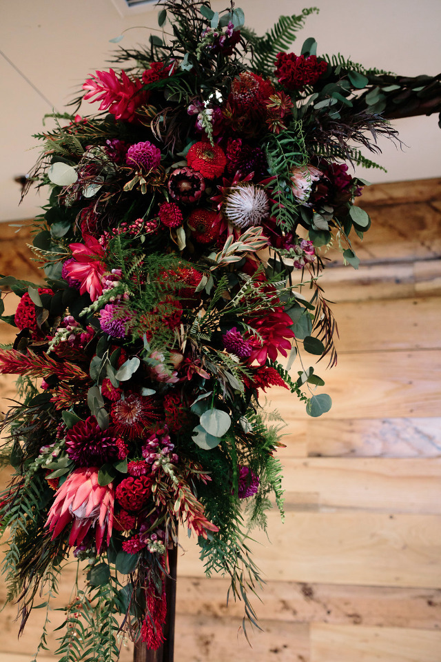 flower detailing on wedding arch