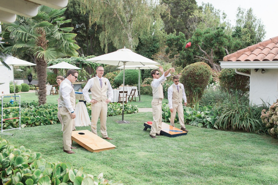 groomsmen playing yard games