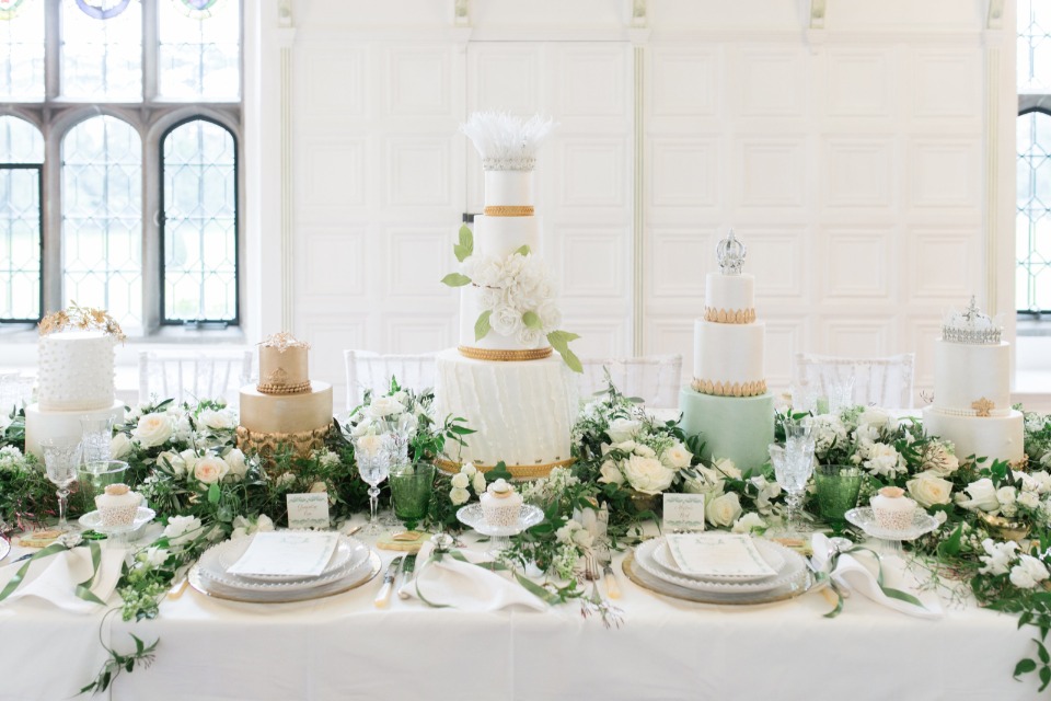 gold white and green wedding table with cake centerpieces