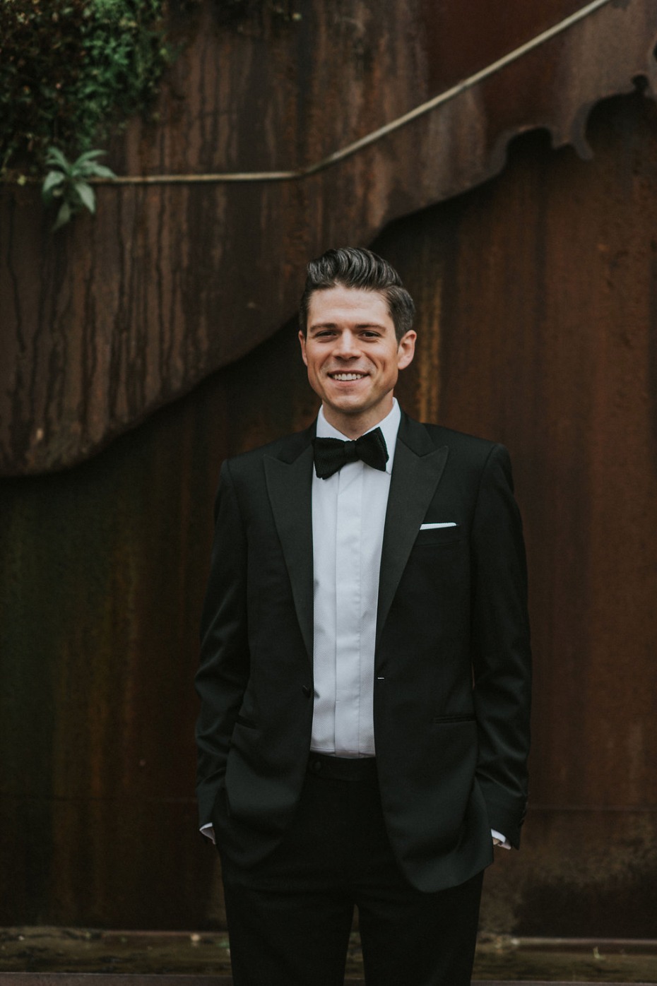 groom in black tie style