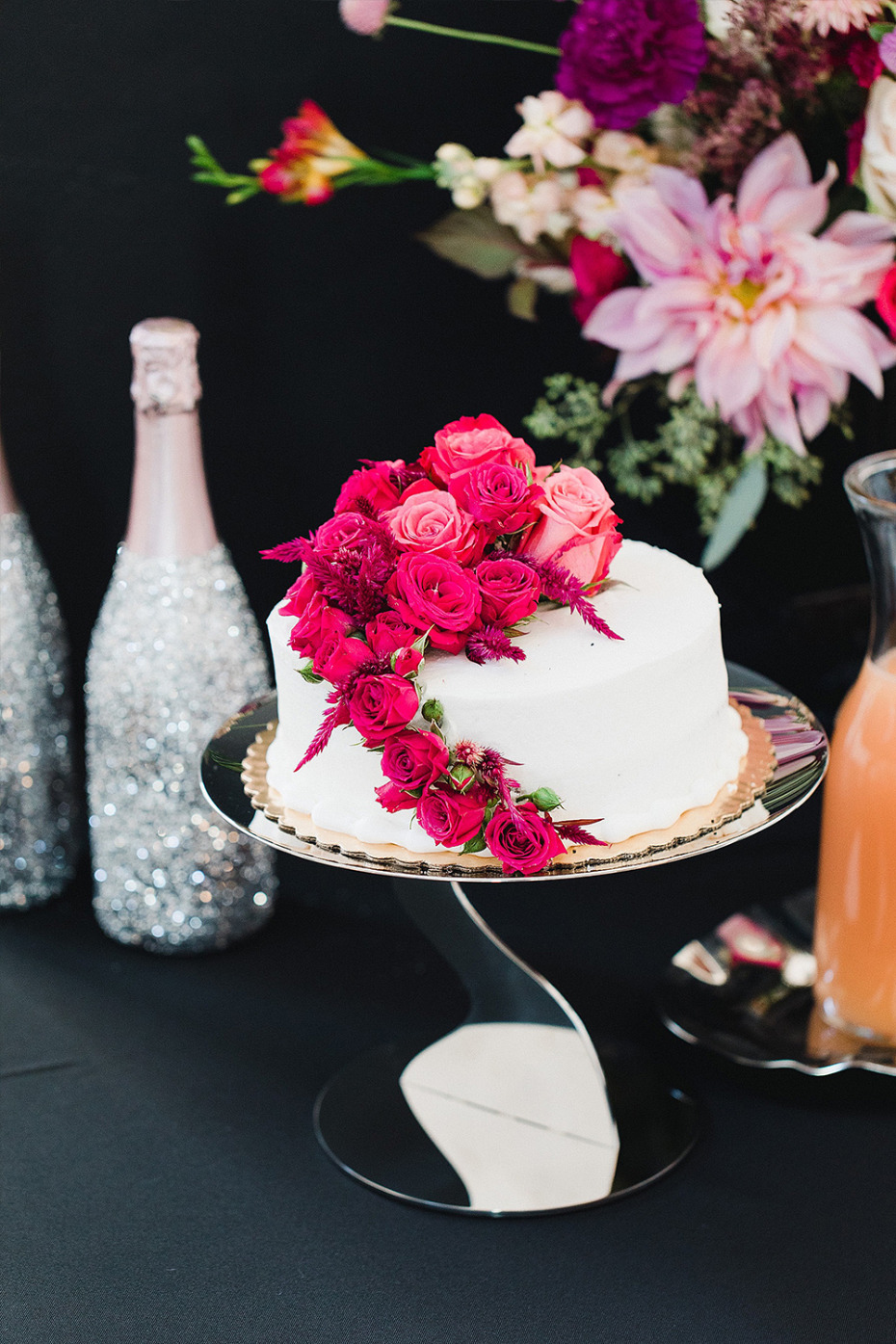 white wedding cake bedazzled with florals