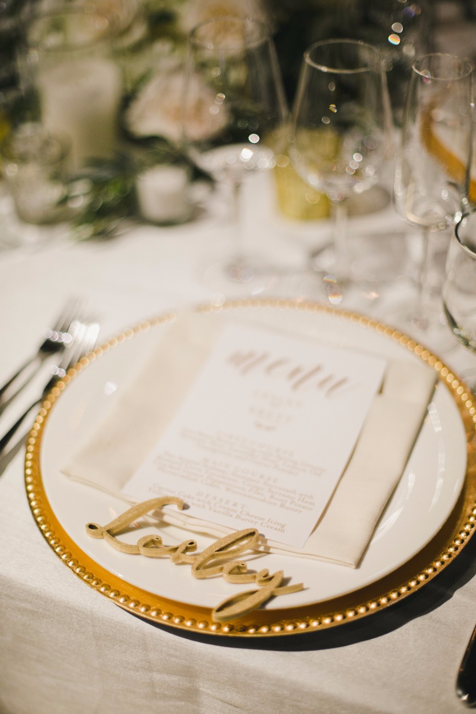 gold and white wedding place setting