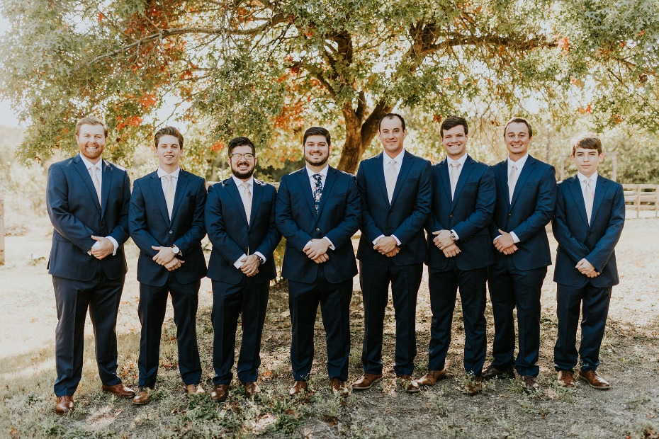 groom and his men in navy suits