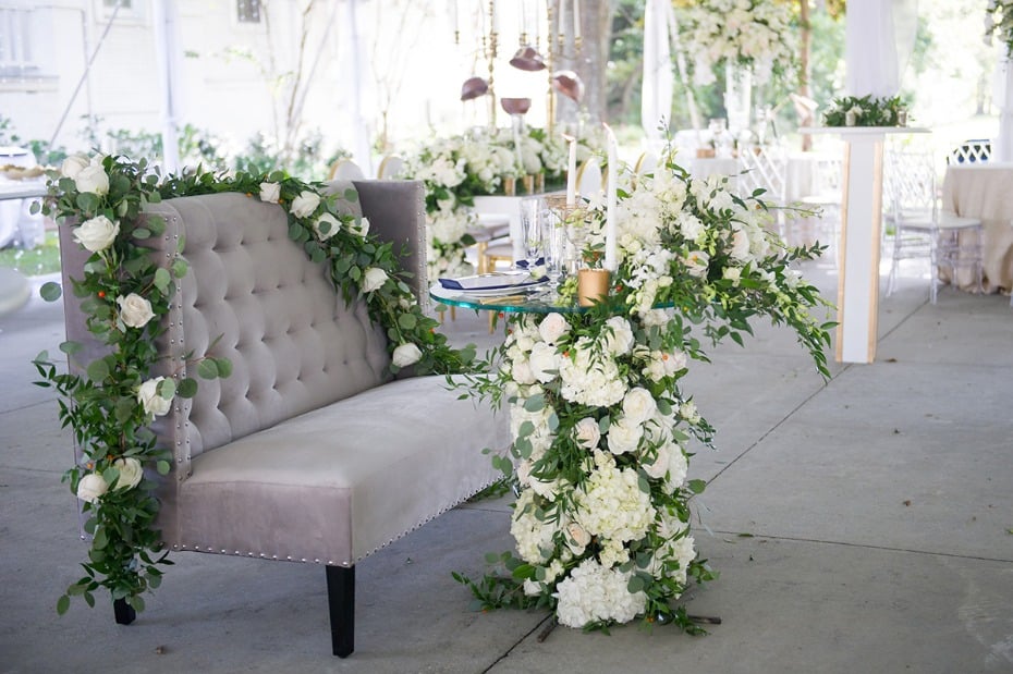 white floral accented sweetheart table
