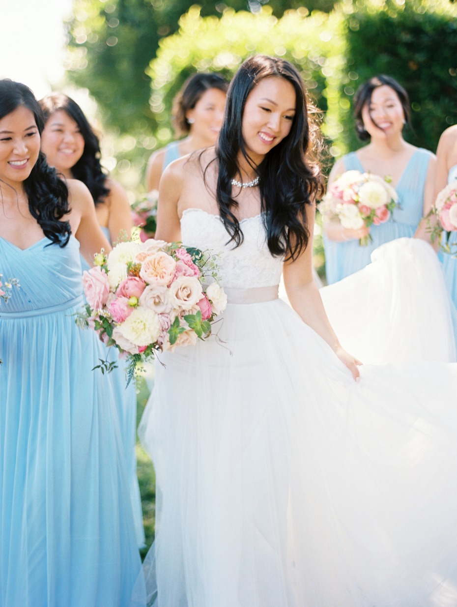 bride and her bridesmaids in light blue