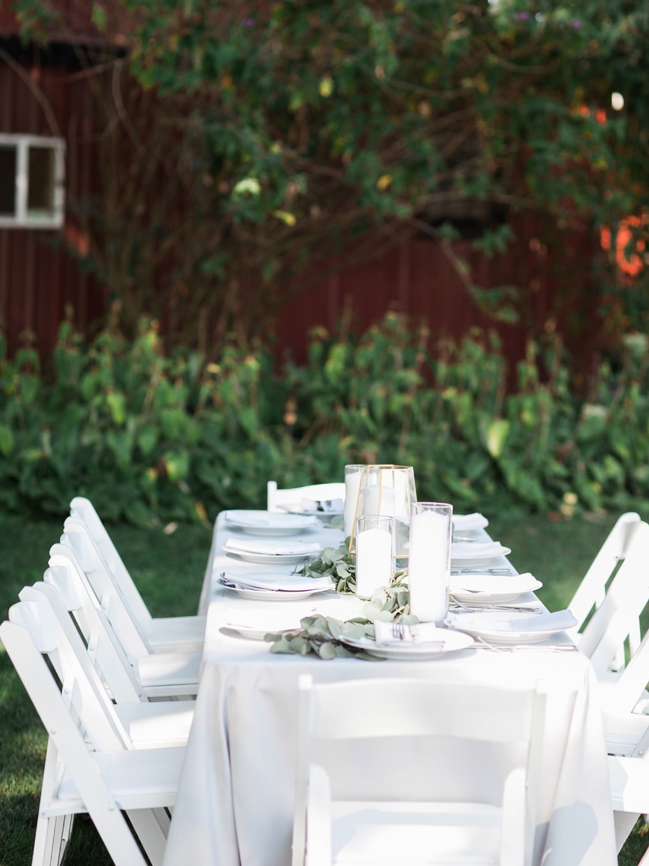 White centerpiece with greenery