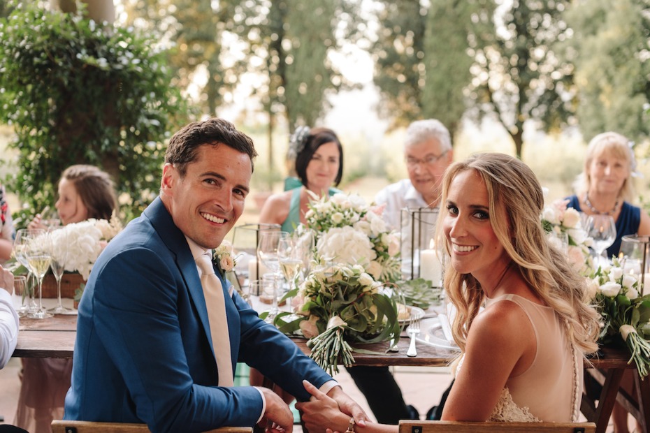 Couple smiling at wedding reception in Tuscany Italy Planned by Wed in Florence