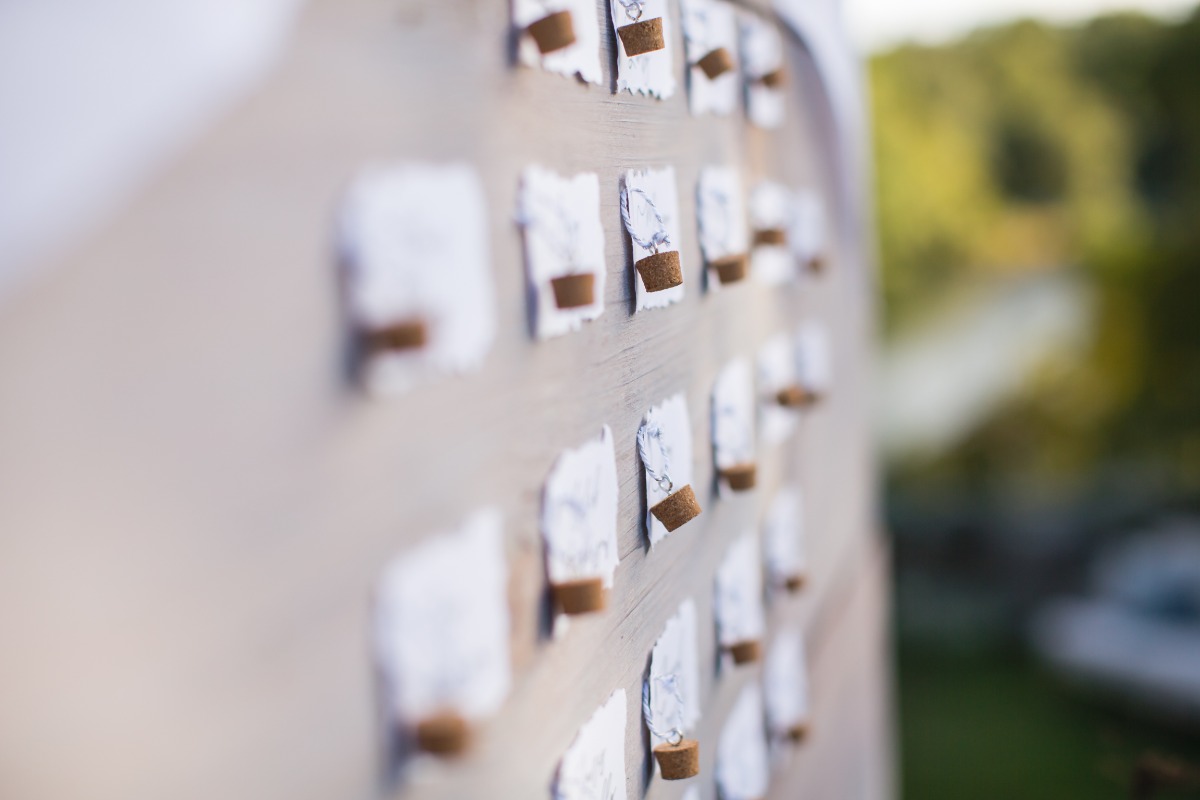 escort cards with corks attached