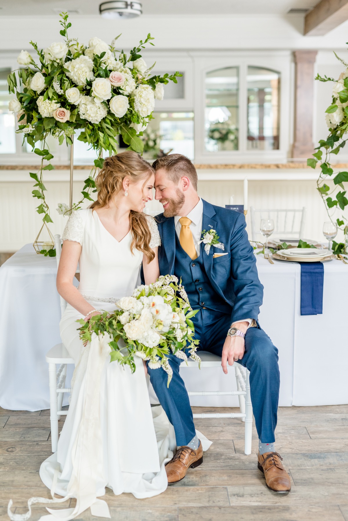 wedding couple at their blue and gold wedding reception