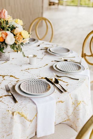 gold and white wedding place setting