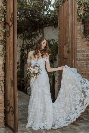 the bride in her off the shoulder wedding dress