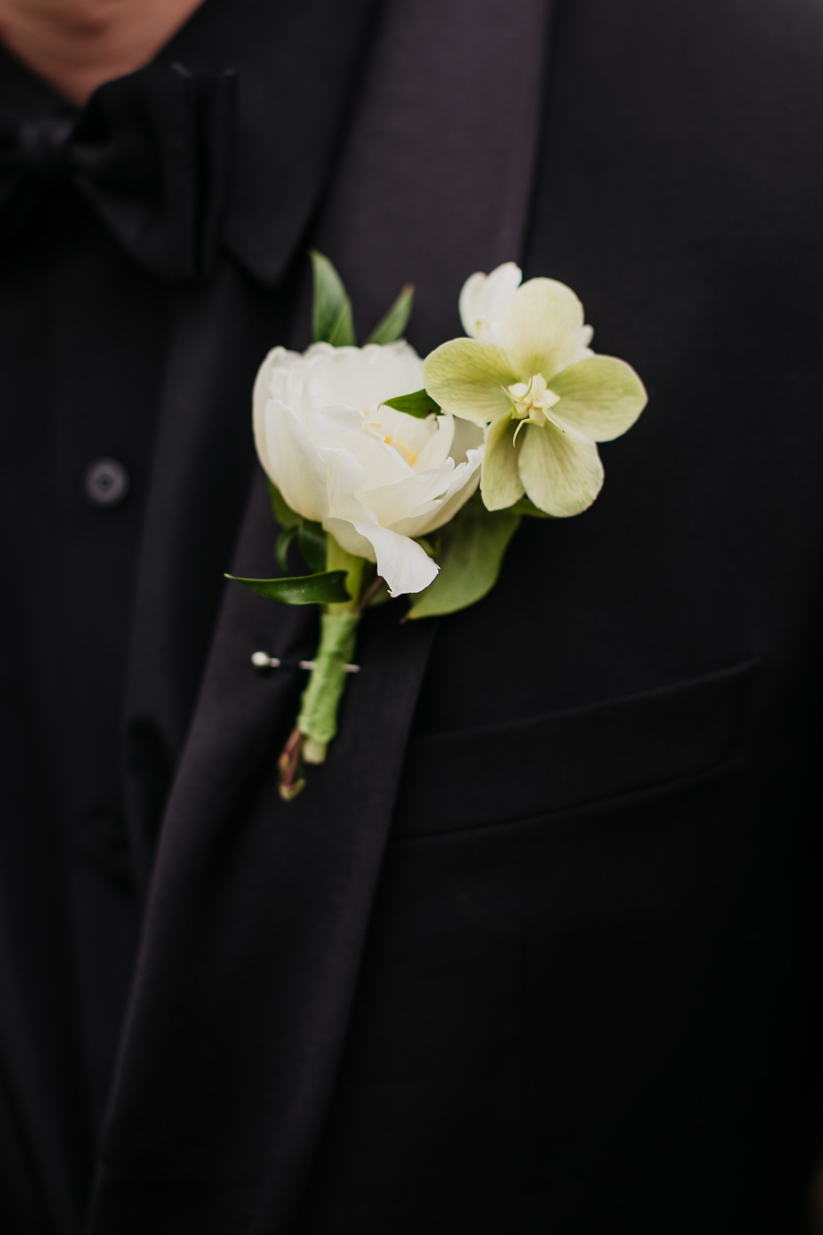 black tuxedo with white boutonniÃ¨re