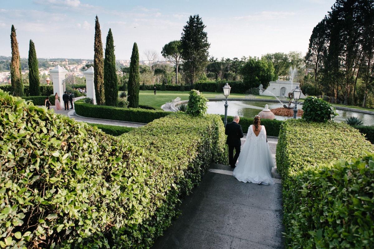 bride walking at Villa Miani with Dad