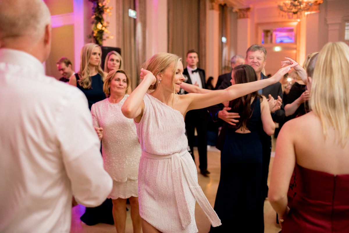 bride dancing the night away in her wedding reception dress