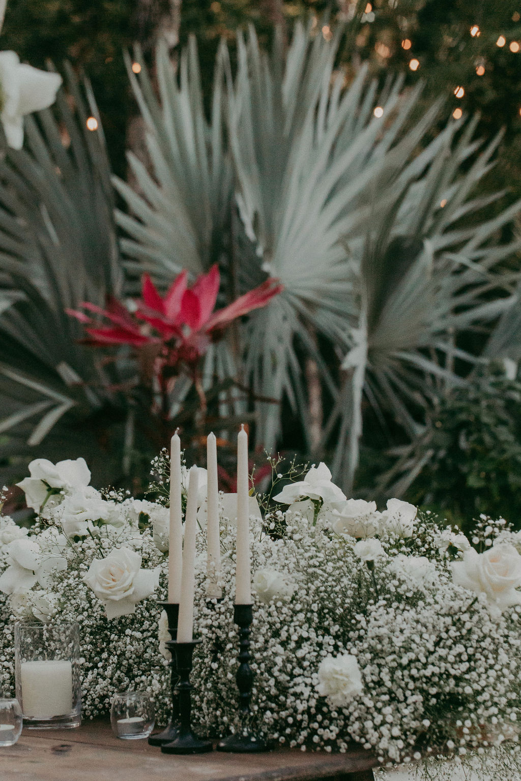 tapered candles and babys breath arrangements