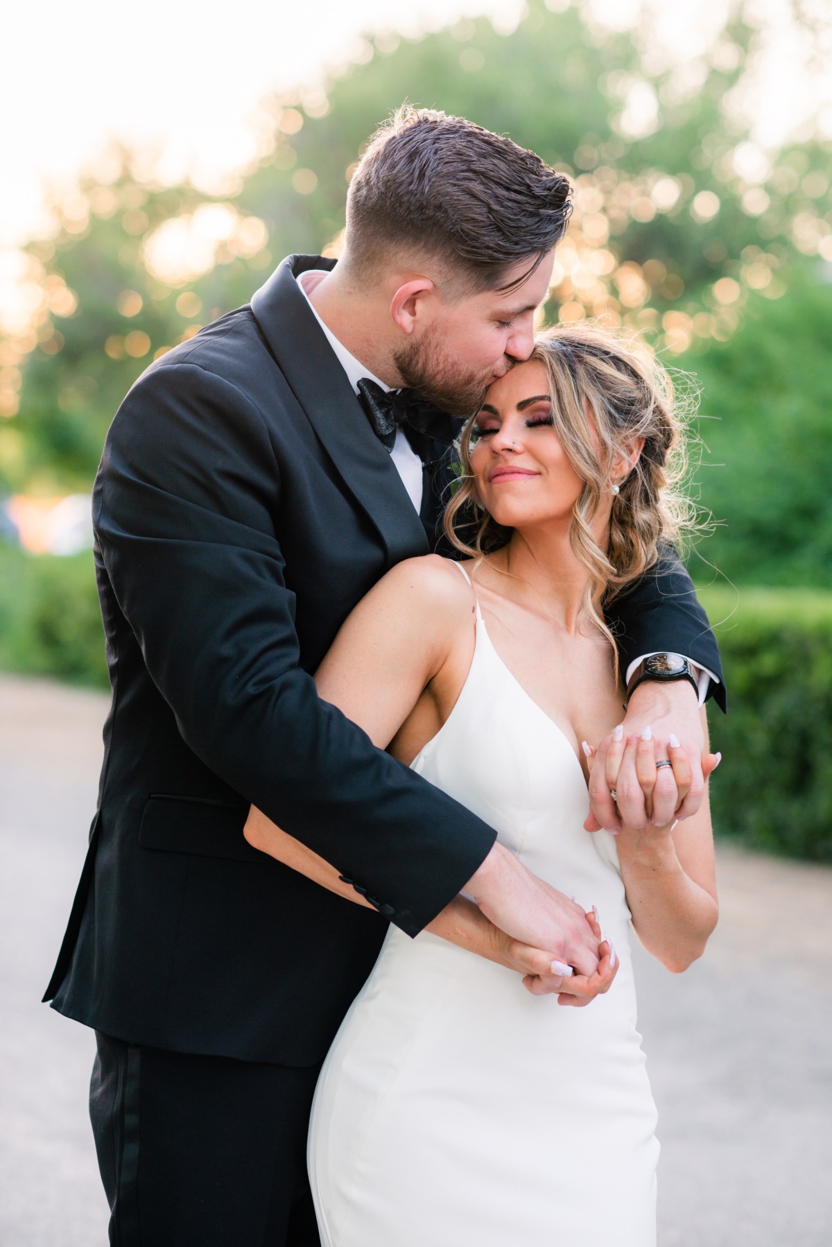 Sweet snuggling bride and groom 