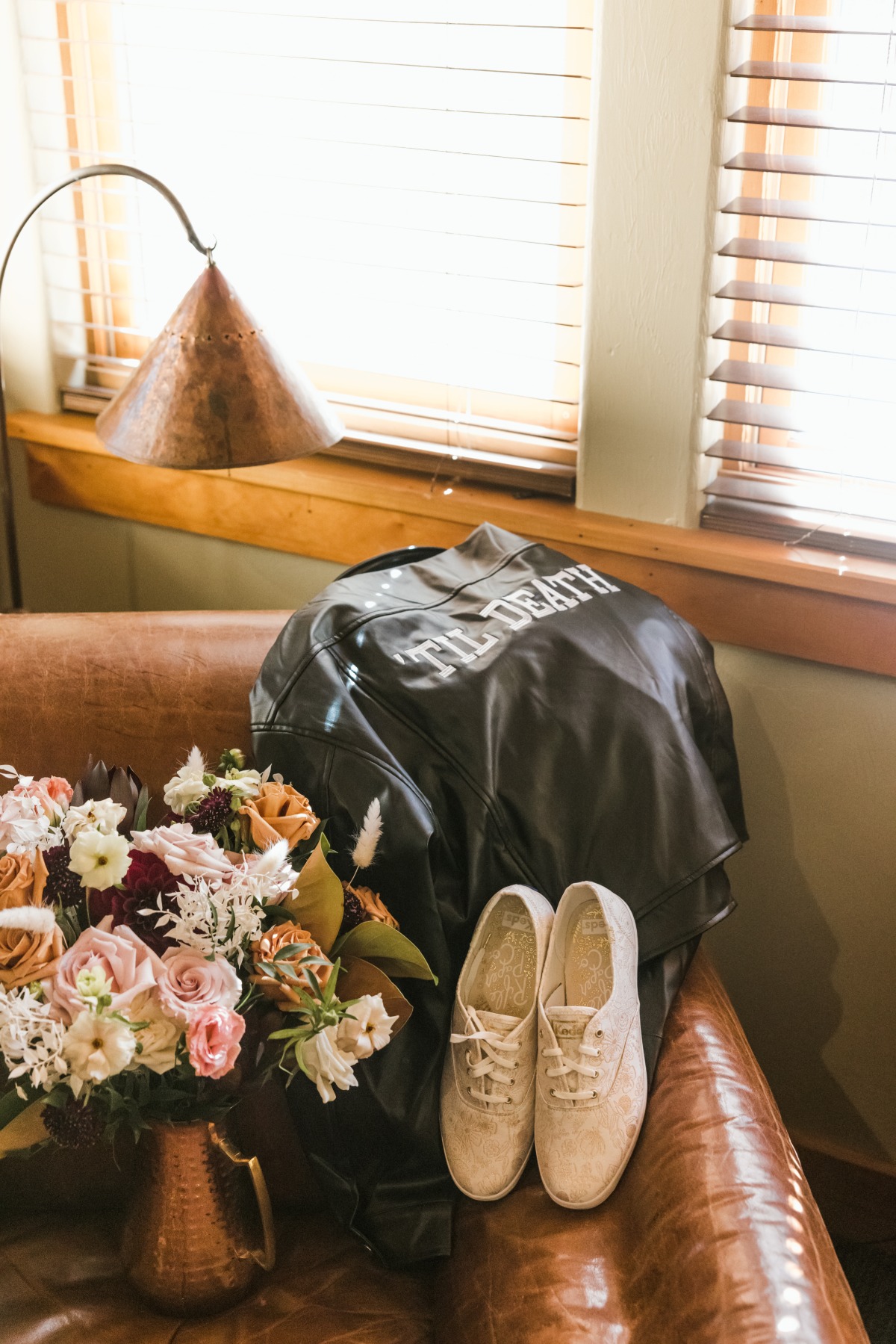 ballet pink sneakers and leather jacket for bride