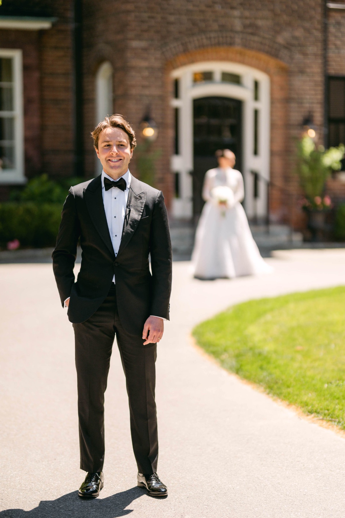 Dapper groom waiting for first look 