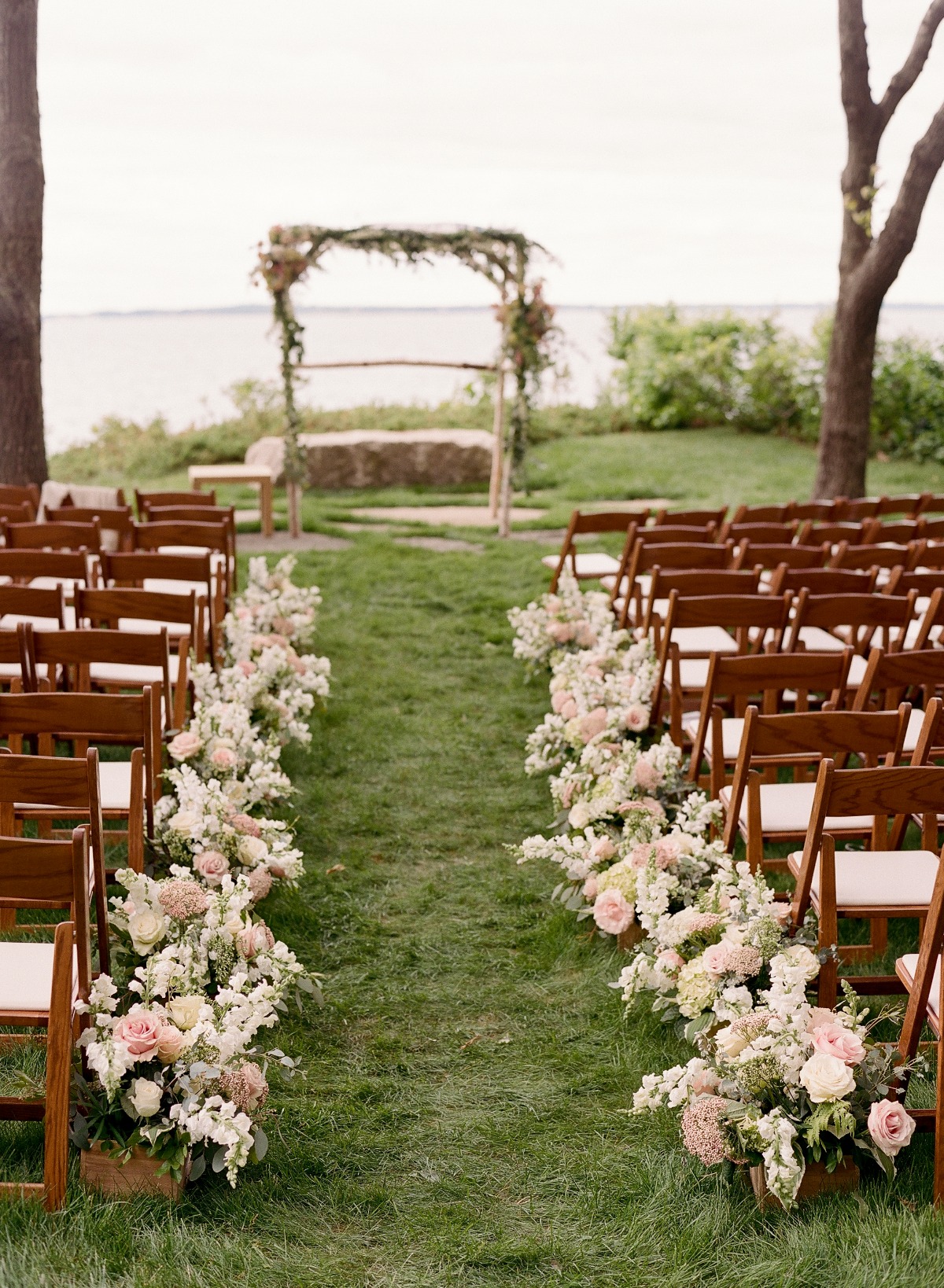 aisle lined with earthy flowers