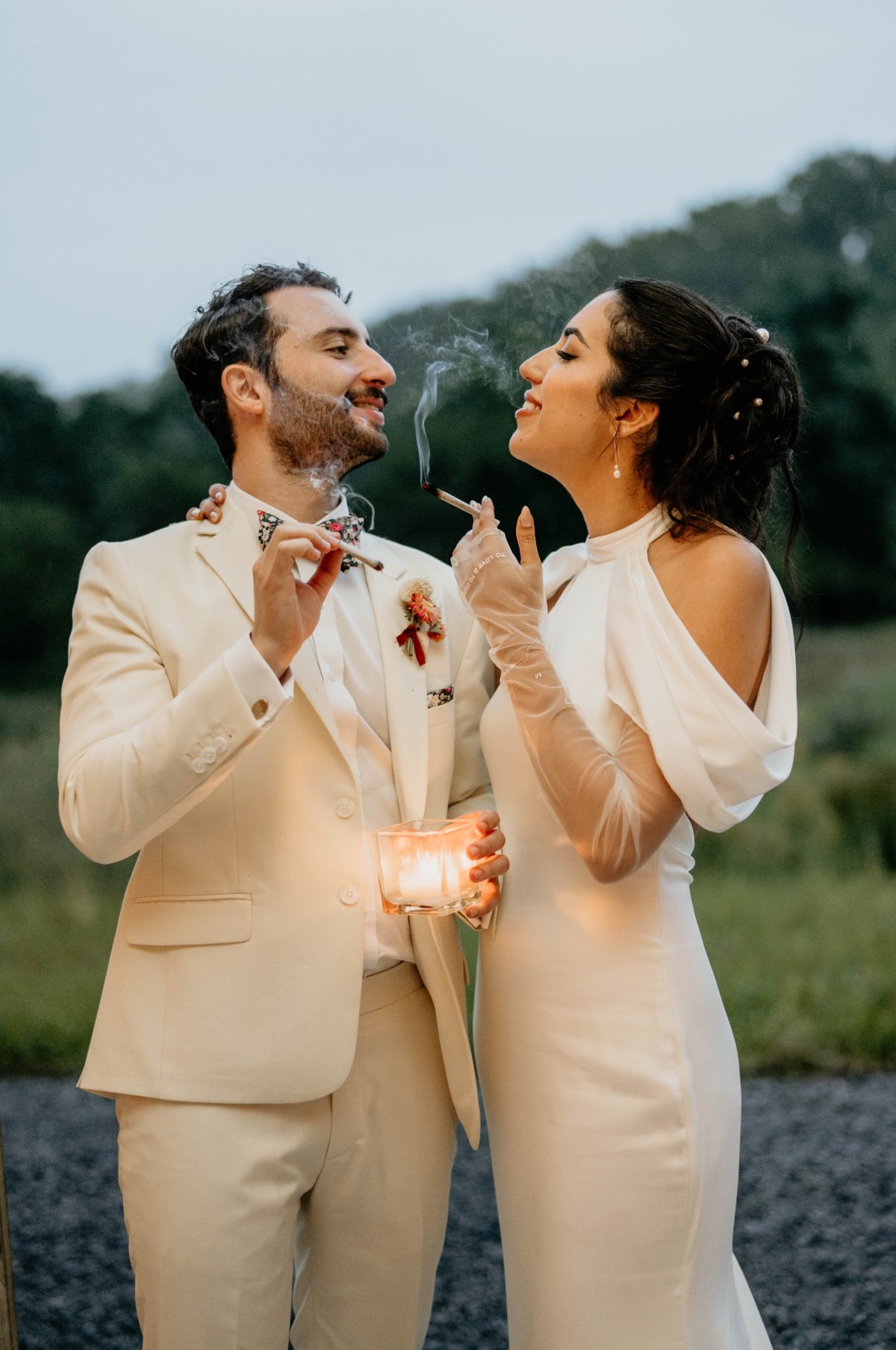bride and groom smoking a joint