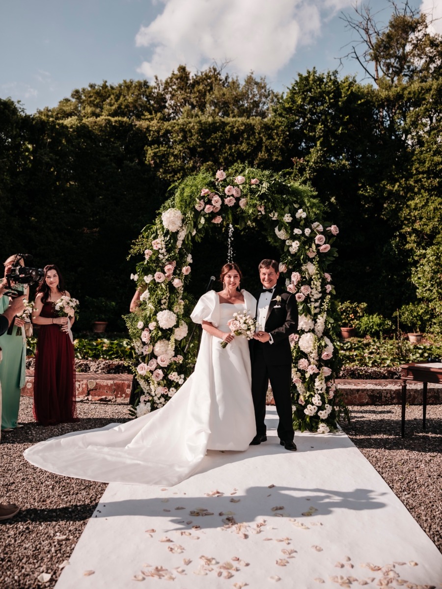 the bride's cape steals the show in this Dreamy Tuscan wedding