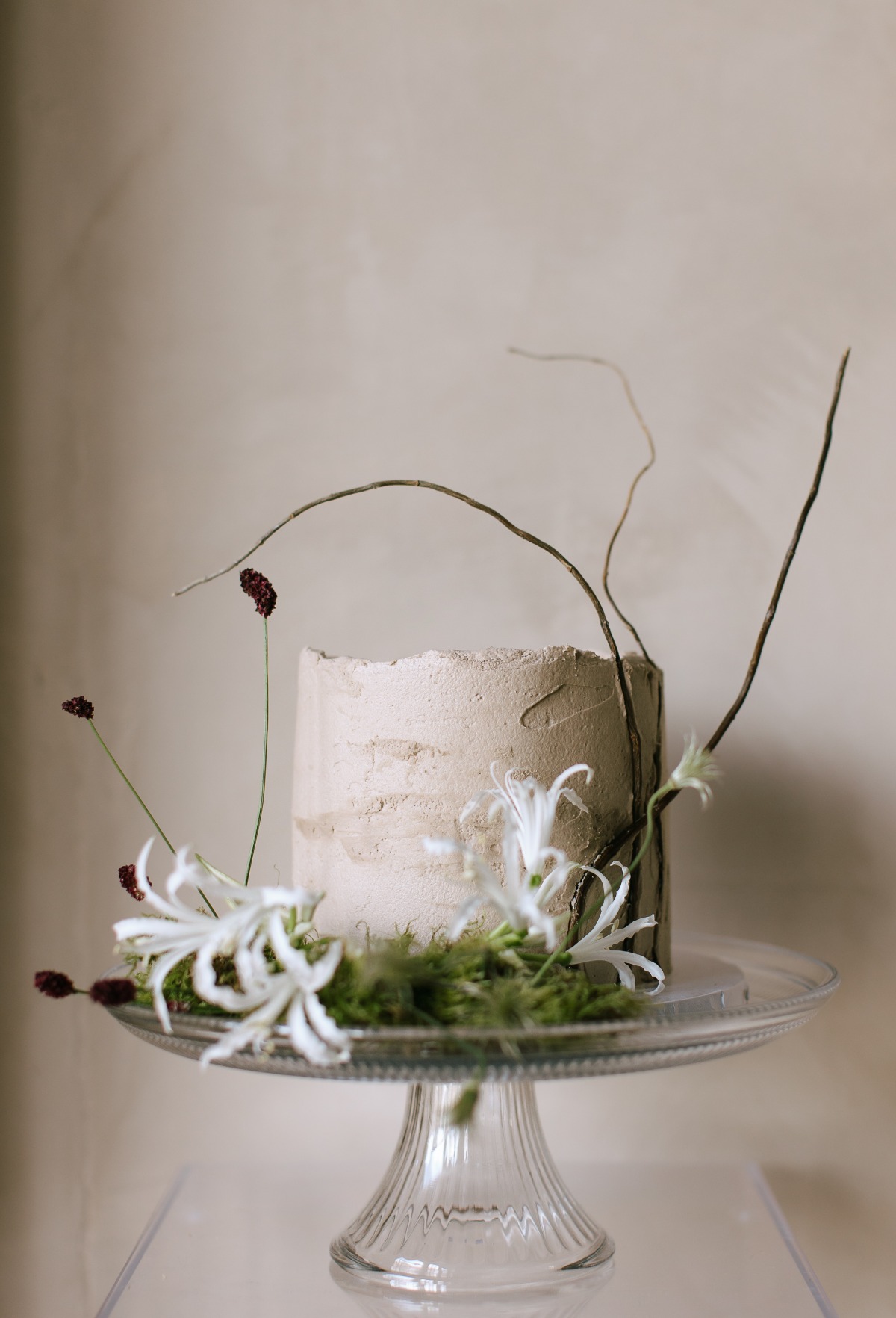 Unique modern earth tone wedding cake with floral details