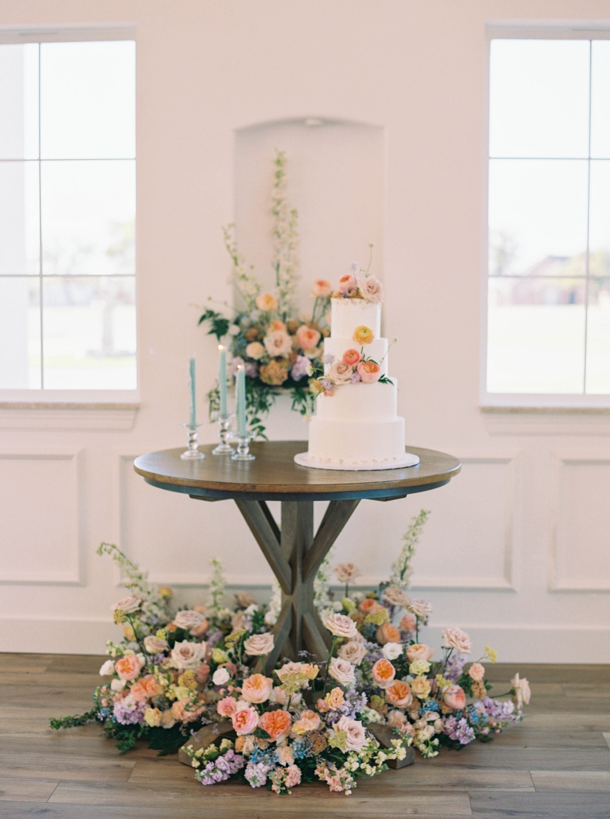 muted rainbow cake table design