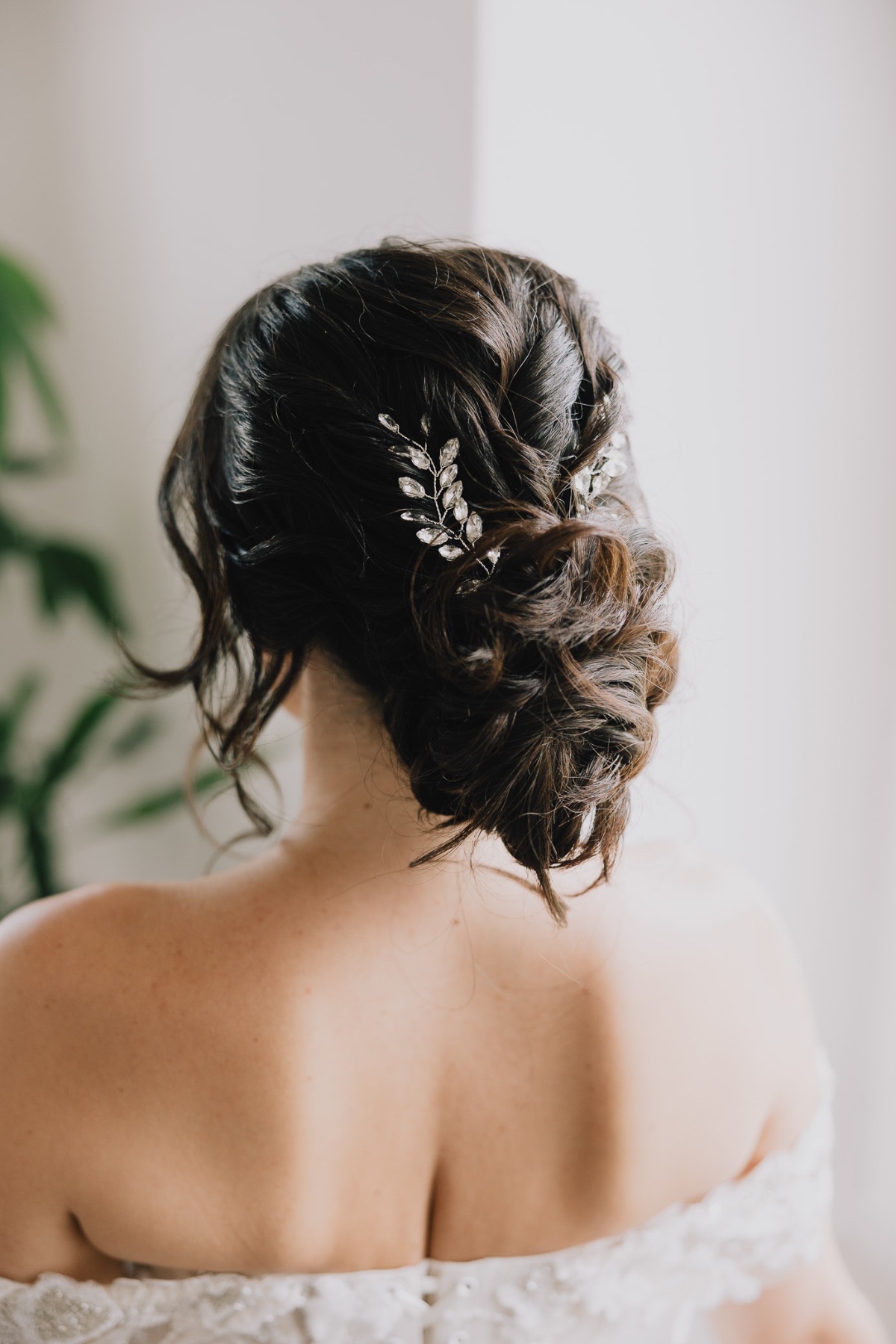 chic chignon hairstyle with rhinestone hairpiece