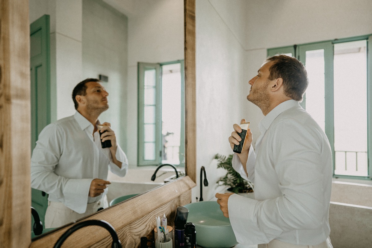 groom getting ready in suite