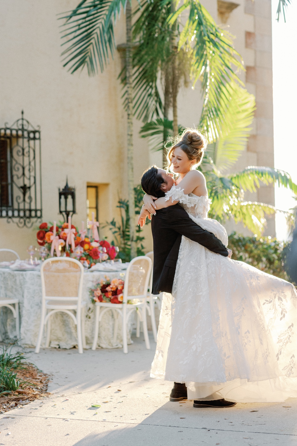 Glamorous bride in Estee Couture lace floral wedding gown