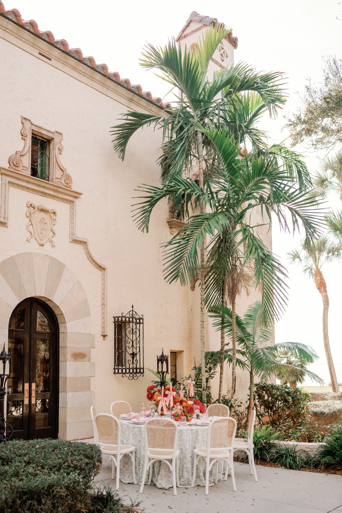 Sarasota Bay wedding at golden hour with sunset florals