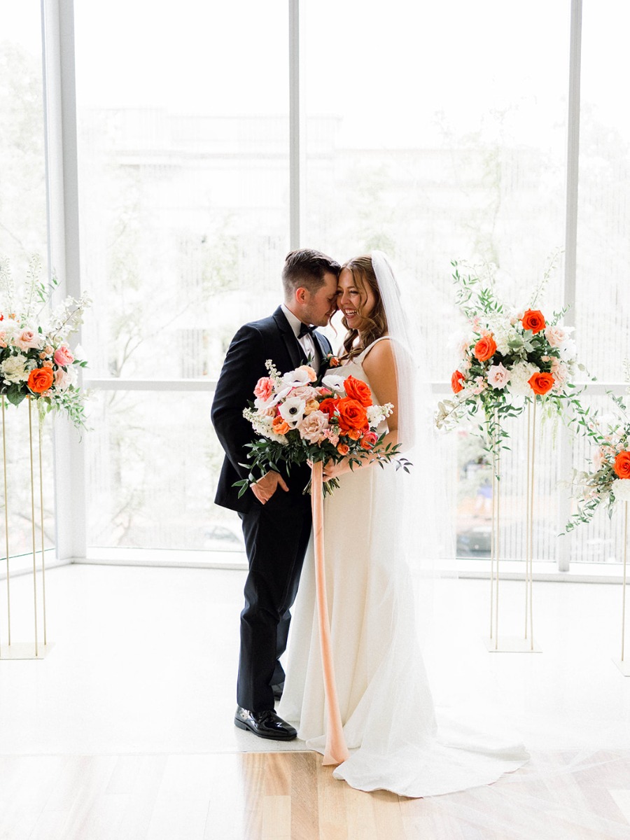 An Indiana wedding at The Commons with the perfect pops of poppy red