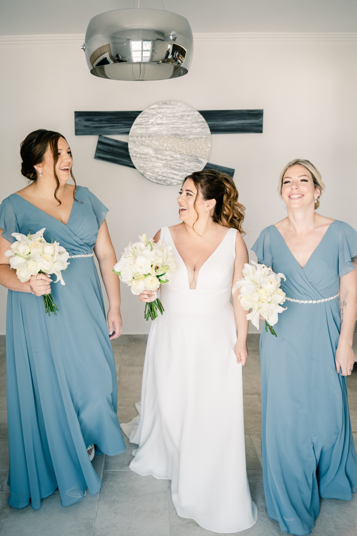Greek bride in Kleinfelds wedding dress with blue bridesmaids
