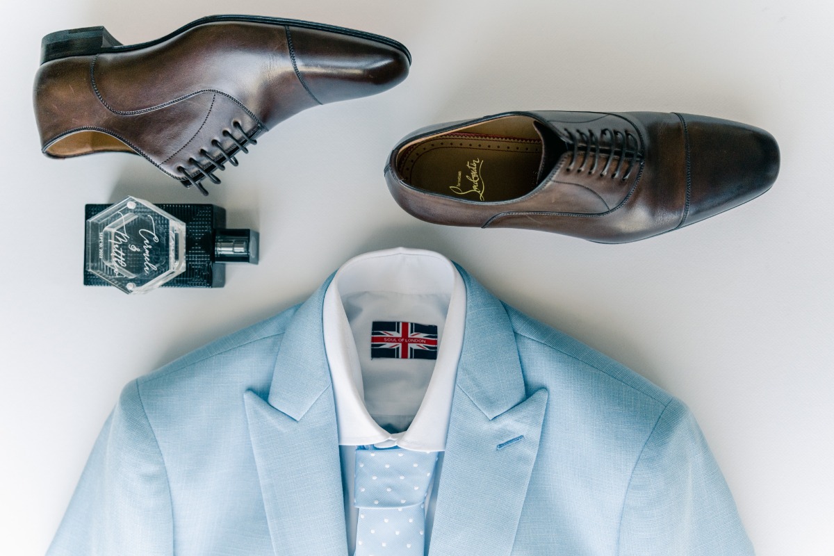 Stylish and modern light blue groom suit and accessories