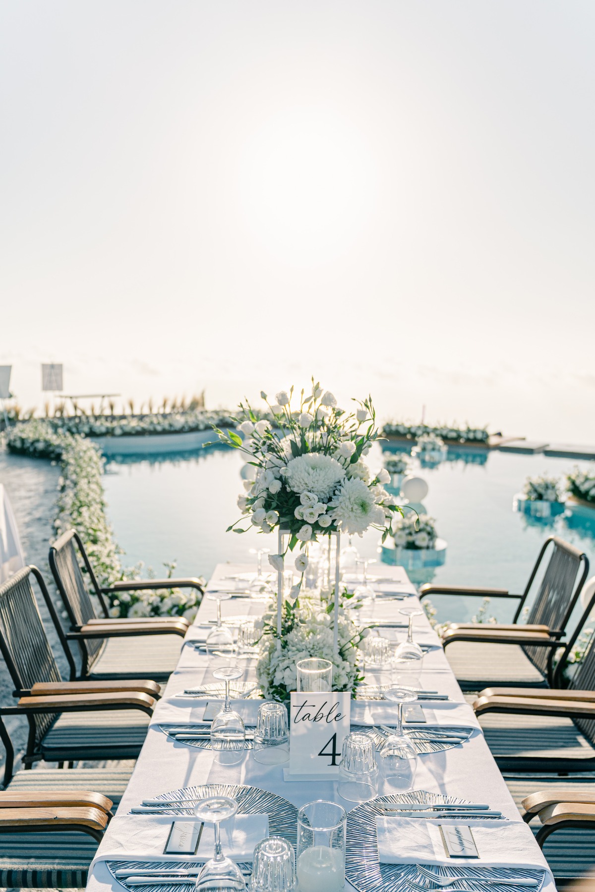 White floral design filled wedding reception in Greece
