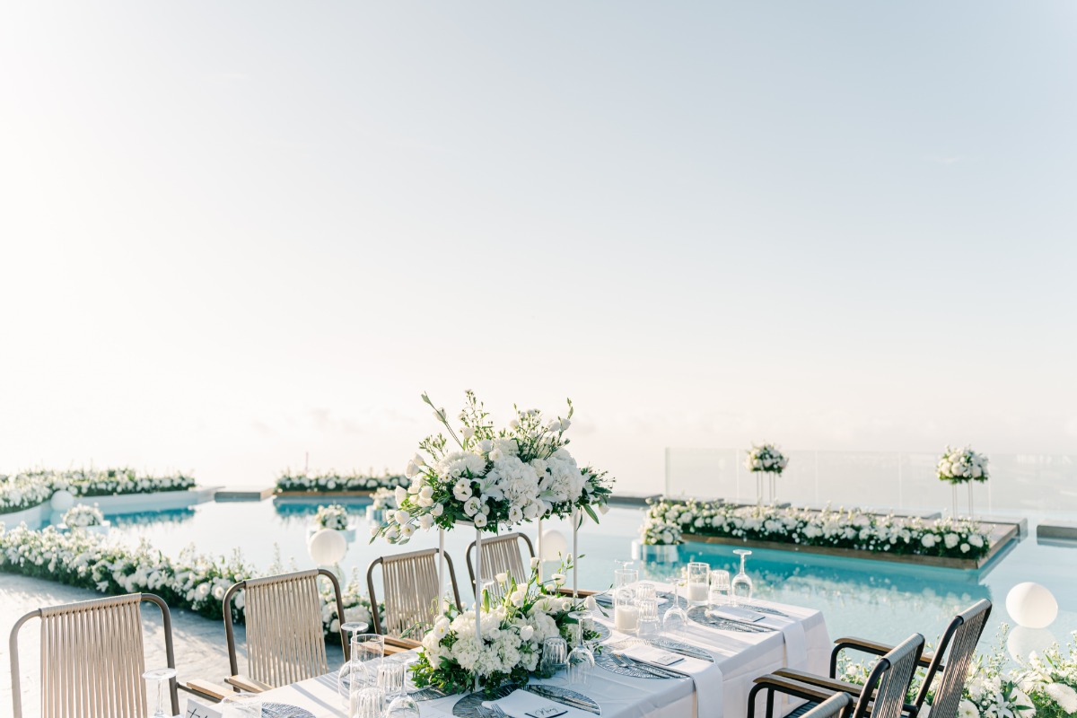 Modern reception table at Greek island wedding dinner