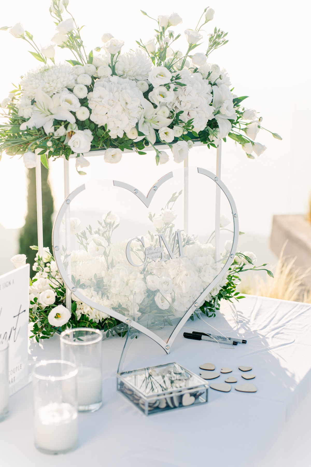 White floral heart shaped guestbook" with wooden hearts to sign