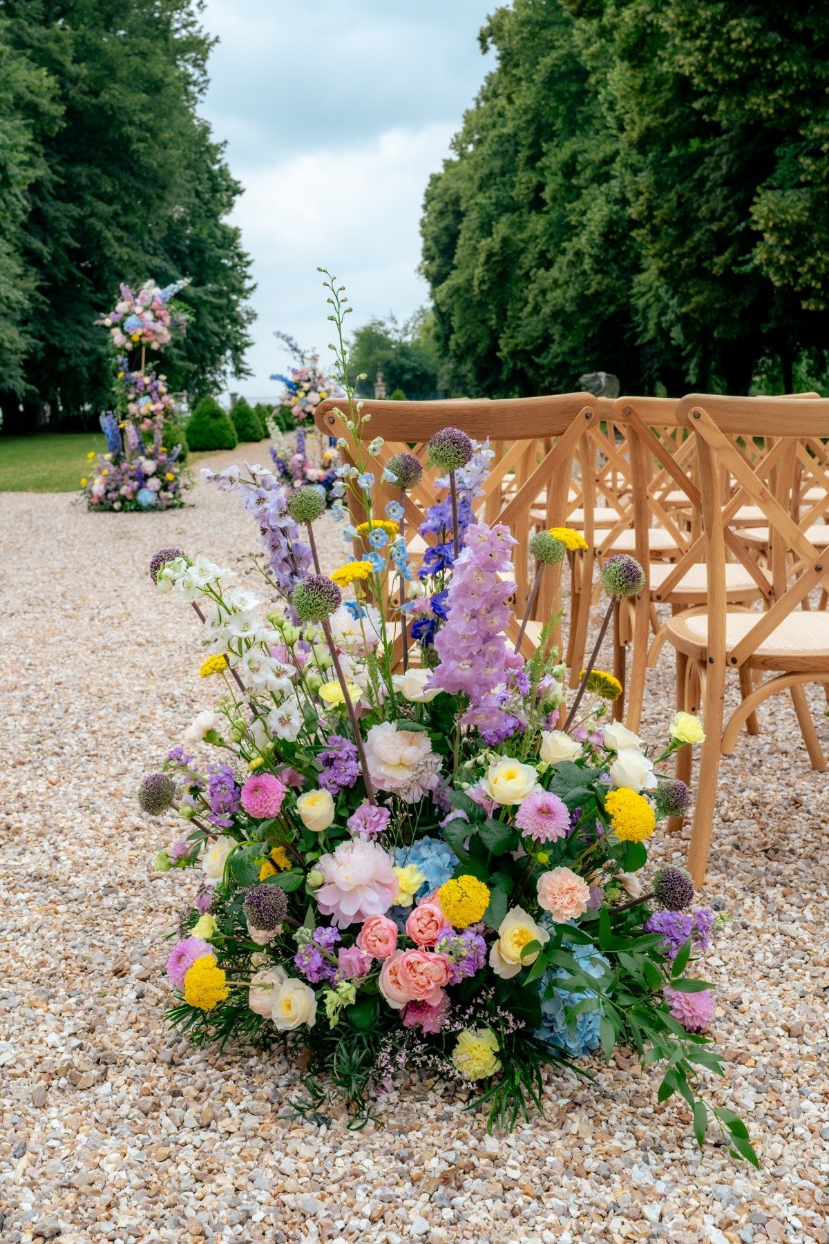 colorful pastel floral wedding ceremony arrangements