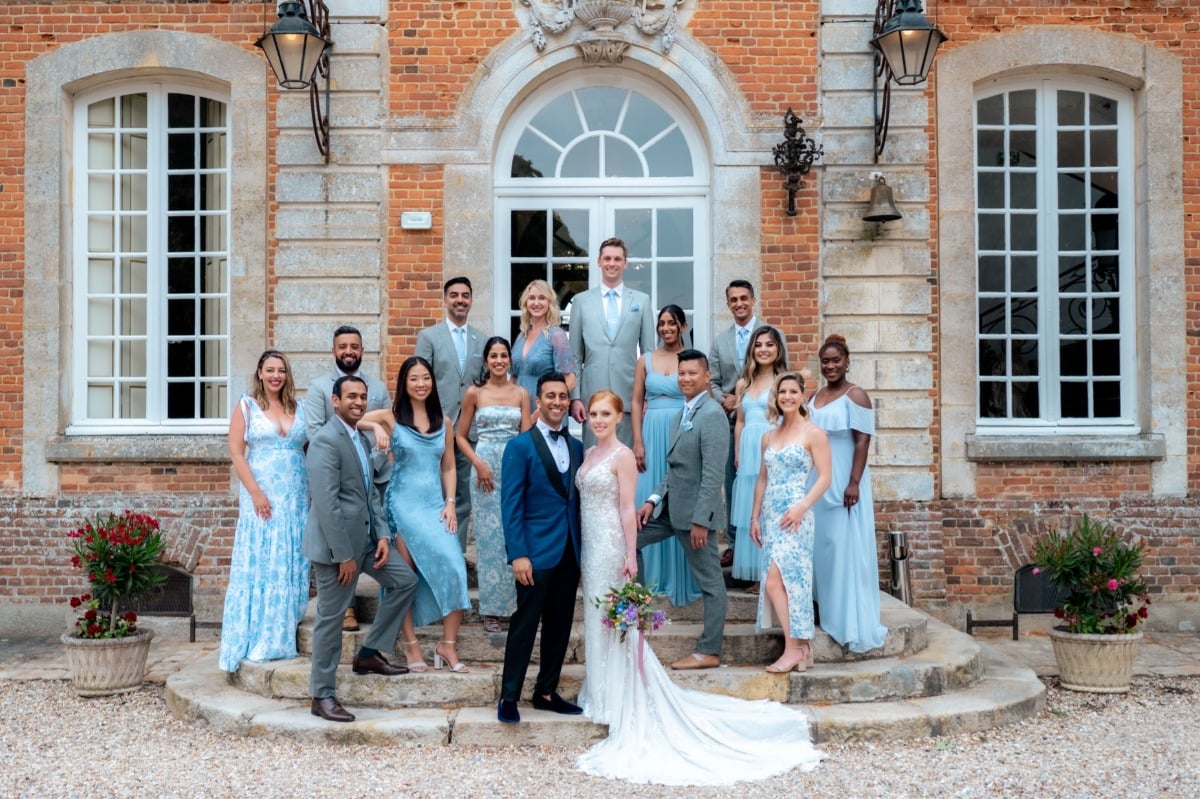 french chateau wedding with bridal party in mix and match blue and gray
