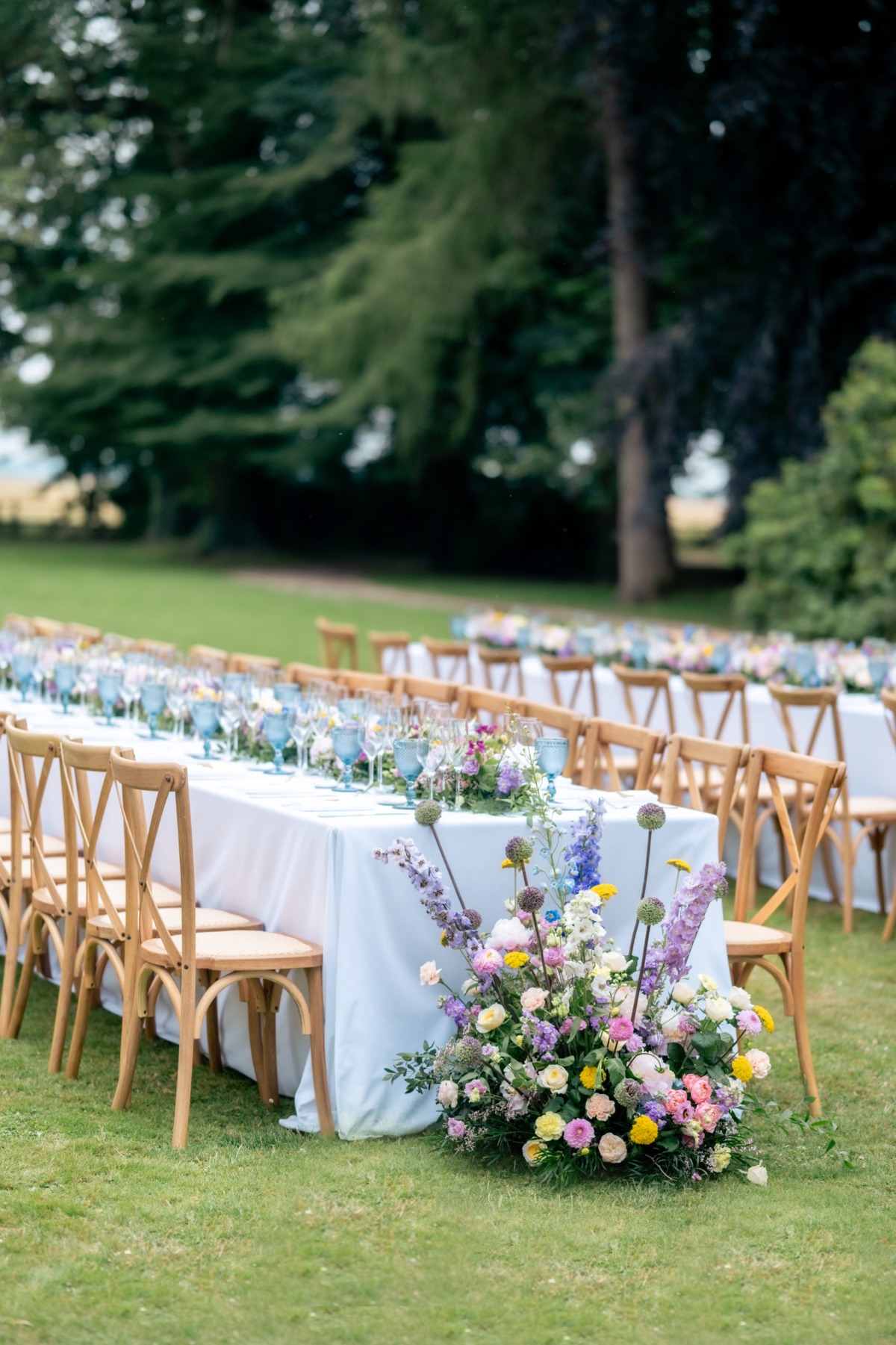 colorful outdoor wedding reception with long tables in france