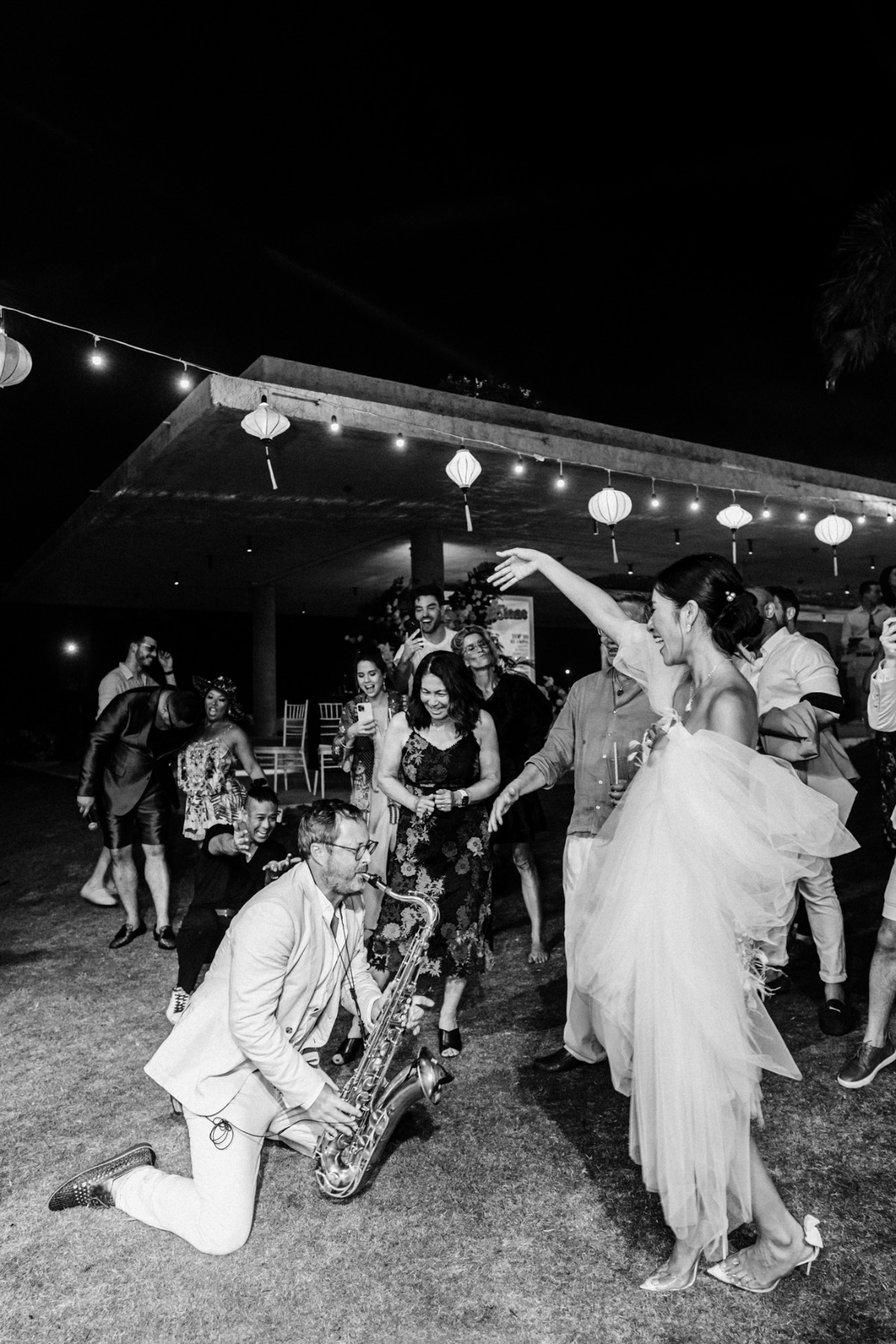 bride dances with live band at music themed wedding